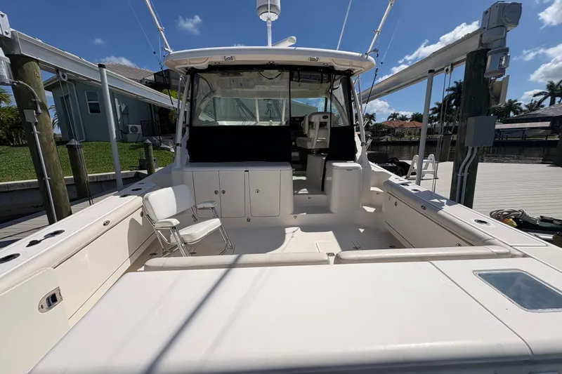 Happy Time 2 Yacht Photos Pics 2011 Pursuit OS 375 Offshore boat docked, showcasing spacious deck and seating area.