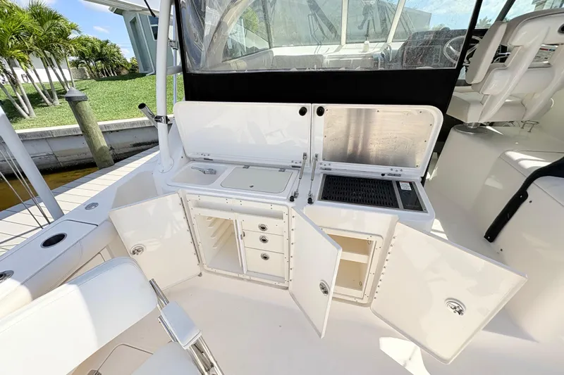 Happy Time 2 Yacht Photos Pics 2011 Pursuit OS 375 Offshore boat with open storage compartments and seating area.