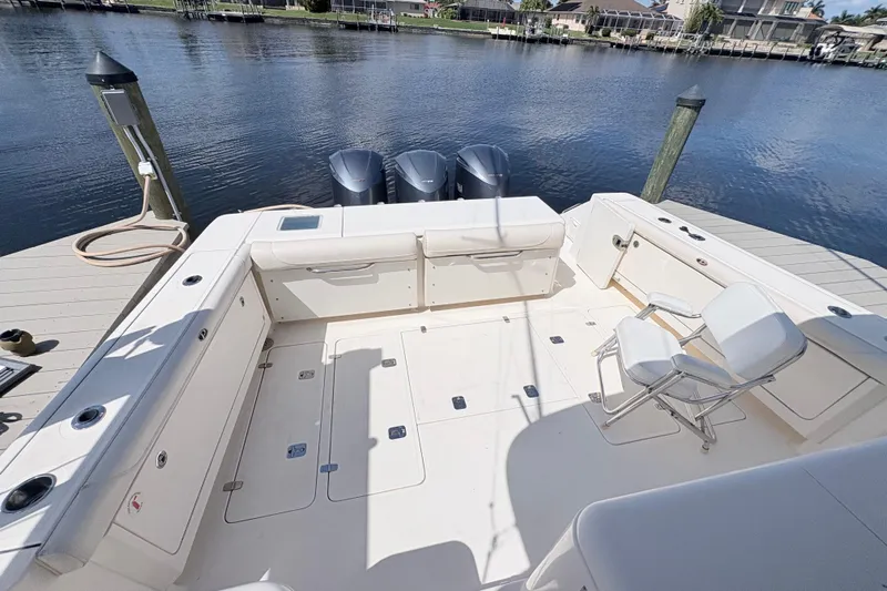 Happy Time 2 Yacht Photos Pics 2011 Pursuit OS 375 Offshore boat deck with seating and triple outboard motors.