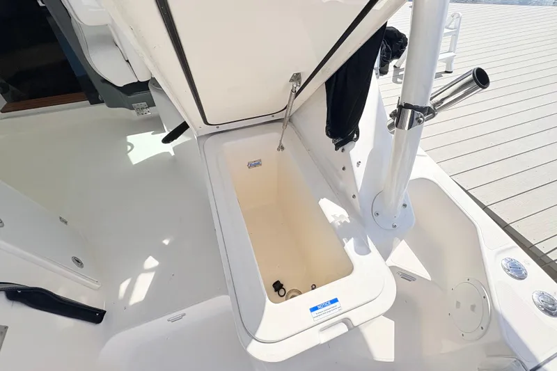 Happy Time 2 Yacht Photos Pics Open storage compartment on a 2011 Pursuit OS 375 Offshore boat deck.