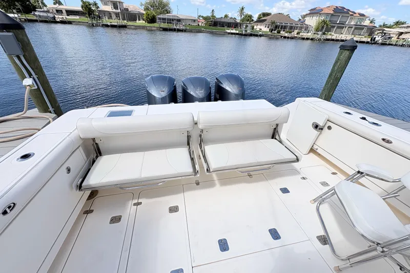 Happy Time 2 Yacht Photos Pics 2011 Pursuit OS 375 Offshore boat with seating and triple outboard motors.