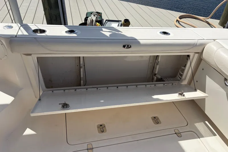Happy Time 2 Yacht Photos Pics 2011 Pursuit OS 375 Offshore boat storage compartment open on deck.