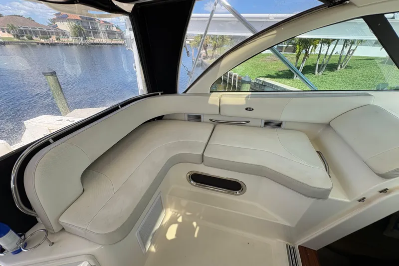 Happy Time 2 Yacht Photos Pics 2011 Pursuit OS 375 Offshore boat interior with white seating and waterfront view.