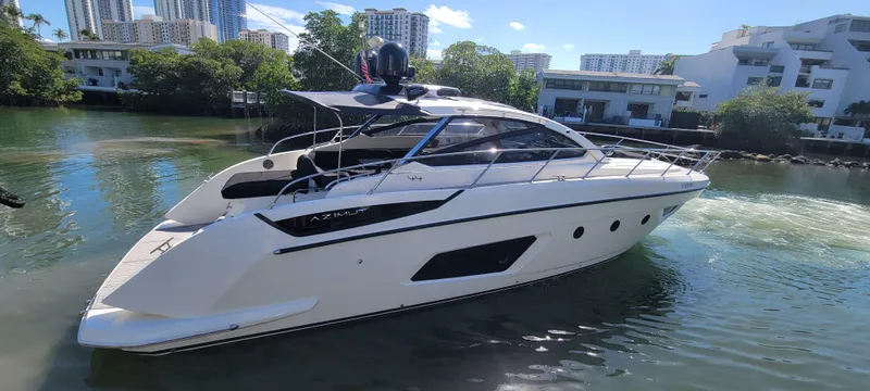  Yacht Photos Pics 2013 Azimut Atlantis 44 yacht cruising in a scenic waterway.