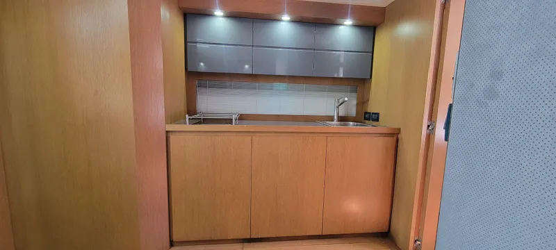  Yacht Photos Pics Modern kitchen interior of 2013 Azimut Atlantis 44 yacht with wooden cabinetry.