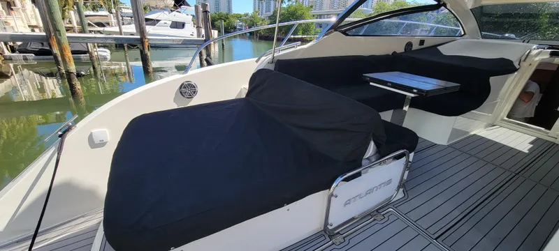  Yacht Photos Pics 2013 Azimut Atlantis 44 yacht deck with black seating covers and sleek design.