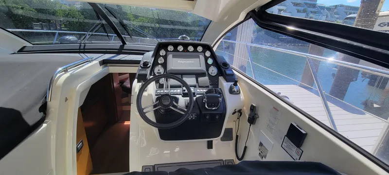  Yacht Photos Pics Cockpit of 2013 Azimut Atlantis 44 yacht with steering wheel and control panel.