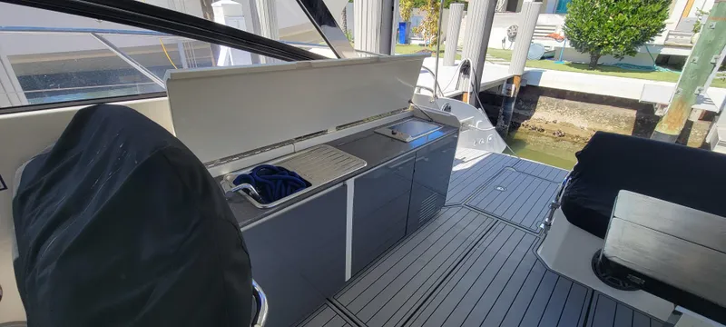  Yacht Photos Pics Azimut Atlantis 44 yacht interior, 2013 model, featuring sleek cabinetry and seating area.