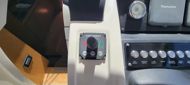  Yacht Photos Pics Control panel of 2013 Azimut Atlantis 44 yacht with joystick and buttons.