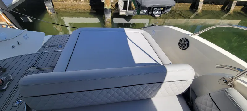  Yacht Photos Pics Luxury seating area on 2013 Azimut Atlantis 44 yacht, docked by the water.