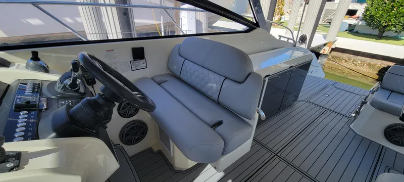  Yacht Photos Pics 2013 Azimut Atlantis 44 yacht interior with sleek helm and comfortable seating.