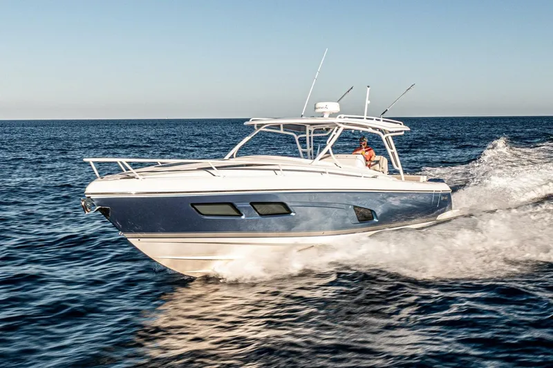  Yacht Photos Pics 2022 Intrepid 409 Valor cruising on open sea under clear sky.