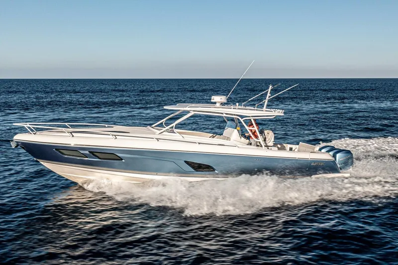  Yacht Photos Pics 2022 Intrepid 409 Valor boat cruising on open sea, side view.