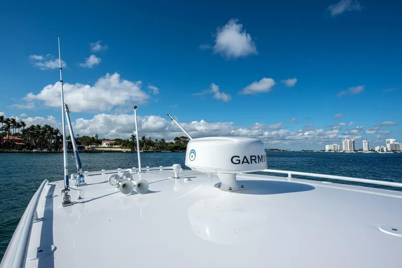  Yacht Photos Pics 2022 Intrepid 409 Valor boat with Garmin radar on deck, cruising under blue skies.