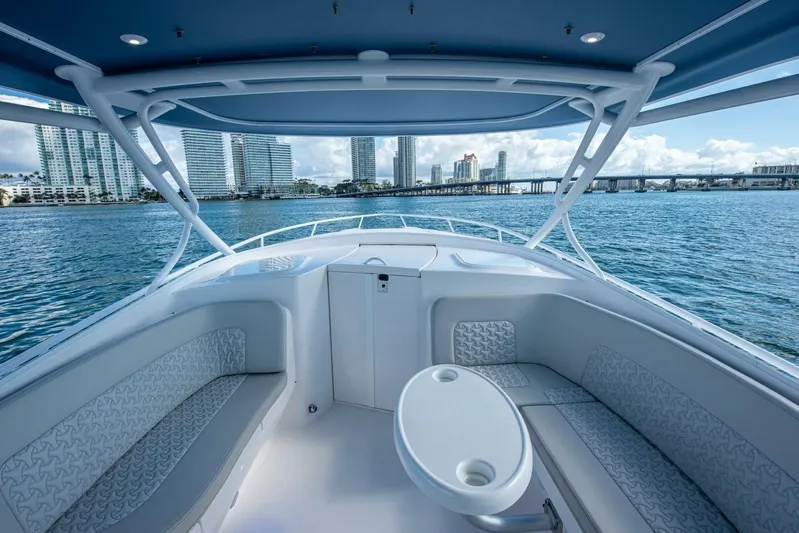  Yacht Photos Pics 2022 Intrepid 409 Valor boat interior with city skyline and ocean view.