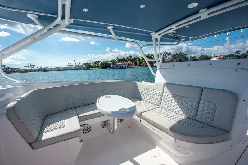  Yacht Photos Pics Luxurious seating area on 2022 Intrepid 409 Valor boat, with ocean view.