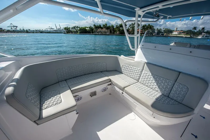  Yacht Photos Pics Luxurious seating area on 2022 Intrepid 409 Valor boat with scenic water view.