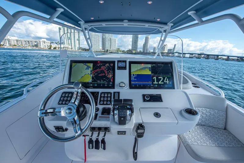  Yacht Photos Pics 2022 Intrepid 409 Valor boat helm with advanced navigation displays and controls.