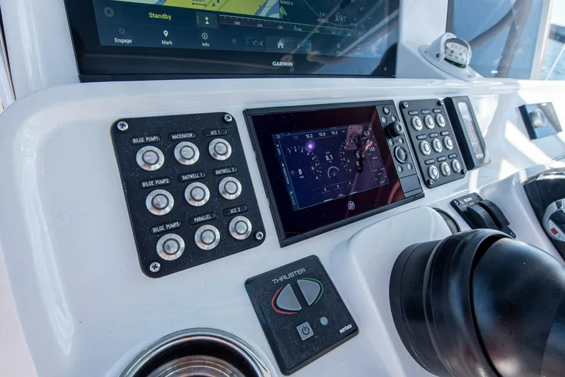  Yacht Photos Pics Control panel of 2022 Intrepid 409 Valor boat with navigation and system controls.