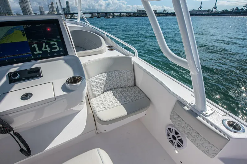  Yacht Photos Pics Interior view of 2022 Intrepid 409 Valor boat with seating and navigation display.