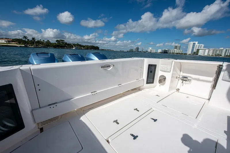  Yacht Photos Pics 2022 Intrepid 409 Valor boat deck with ocean view and city skyline.
