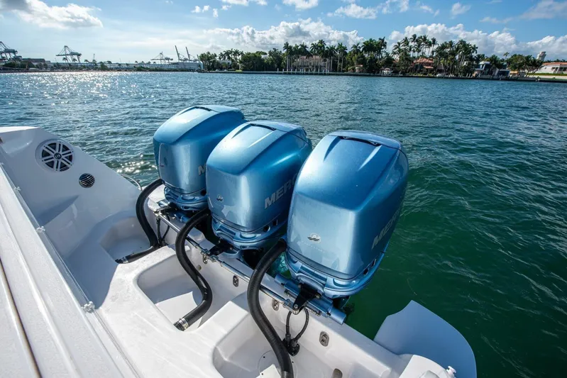  Yacht Photos Pics 2022 Intrepid 409 Valor boat with triple Mercury outboard engines on water.