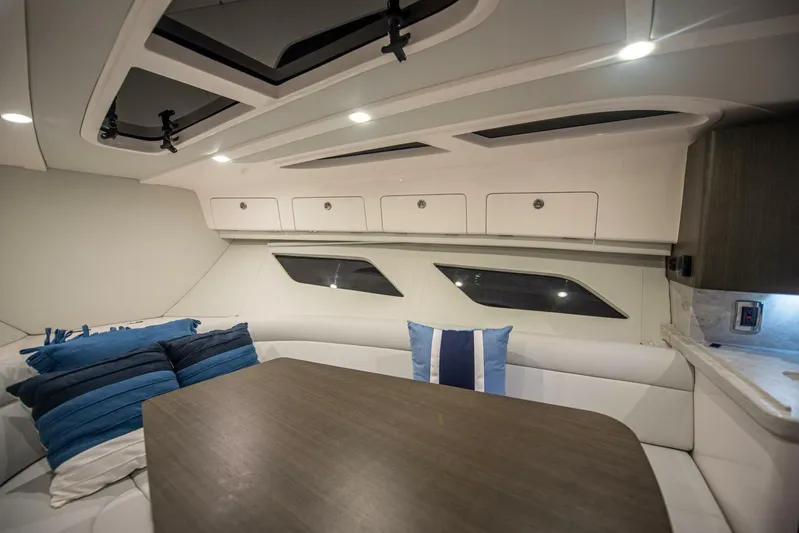  Yacht Photos Pics Luxurious interior of 2022 Intrepid 409 Valor boat with modern seating and stylish decor.