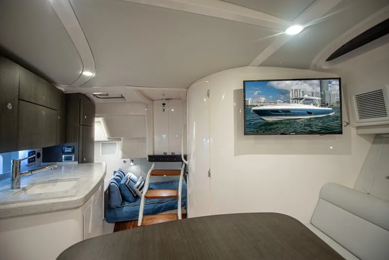  Yacht Photos Pics Luxurious interior of 2022 Intrepid 409 Valor yacht with modern amenities and sleek design.
