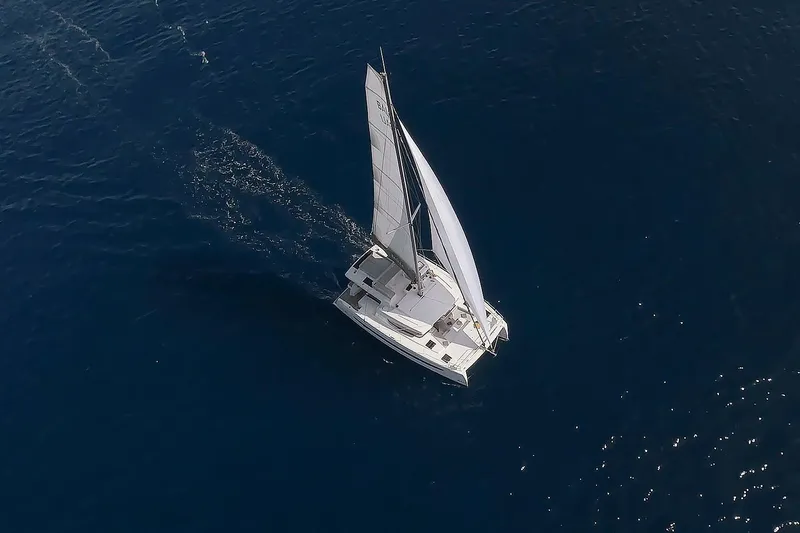  Yacht Photos Pics Aerial view of 2026 Bali 4.4 sailboat cruising on open blue sea.