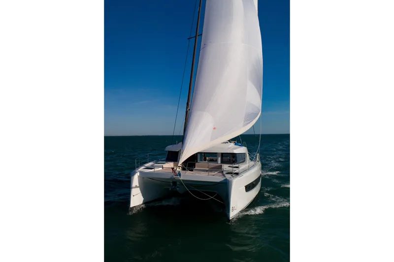  Yacht Photos Pics Sailing catamaran Bali 4.4, 2026 model, gliding on open sea under clear blue sky.