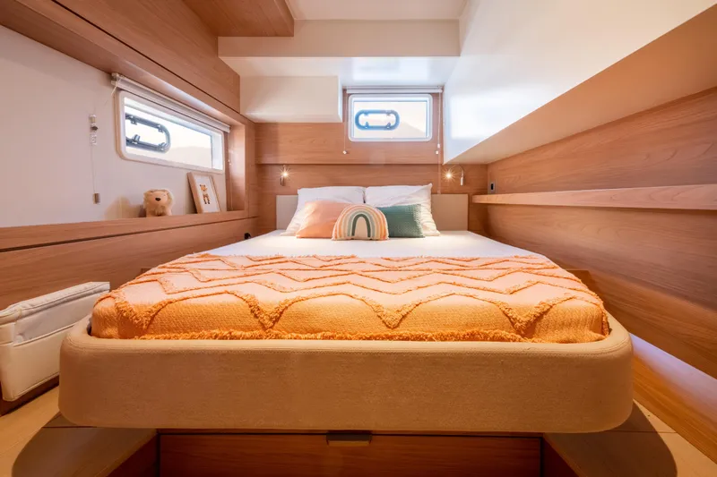  Yacht Photos Pics Luxurious cabin interior of 2026 Bali 4.4 yacht with cozy bed and modern design.