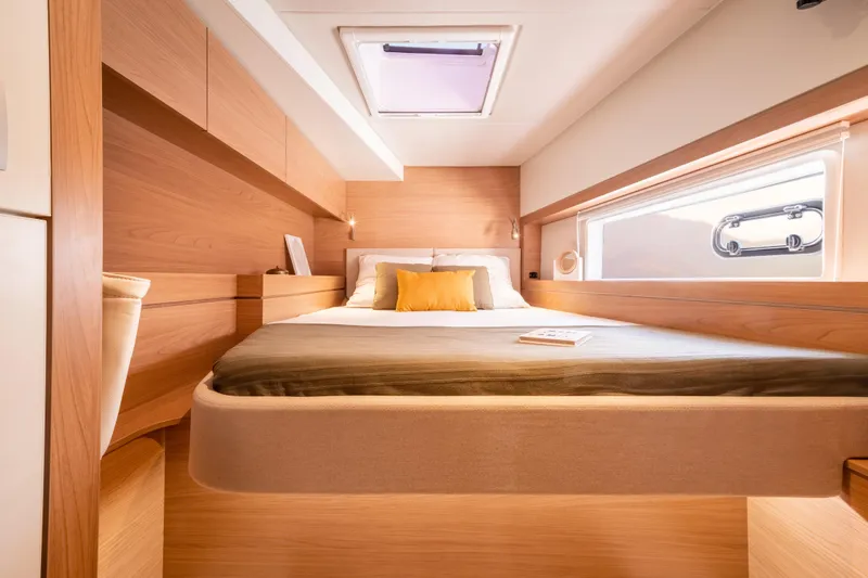  Yacht Photos Pics Luxurious cabin interior of 2026 Bali 4.4 yacht with modern wood finish.