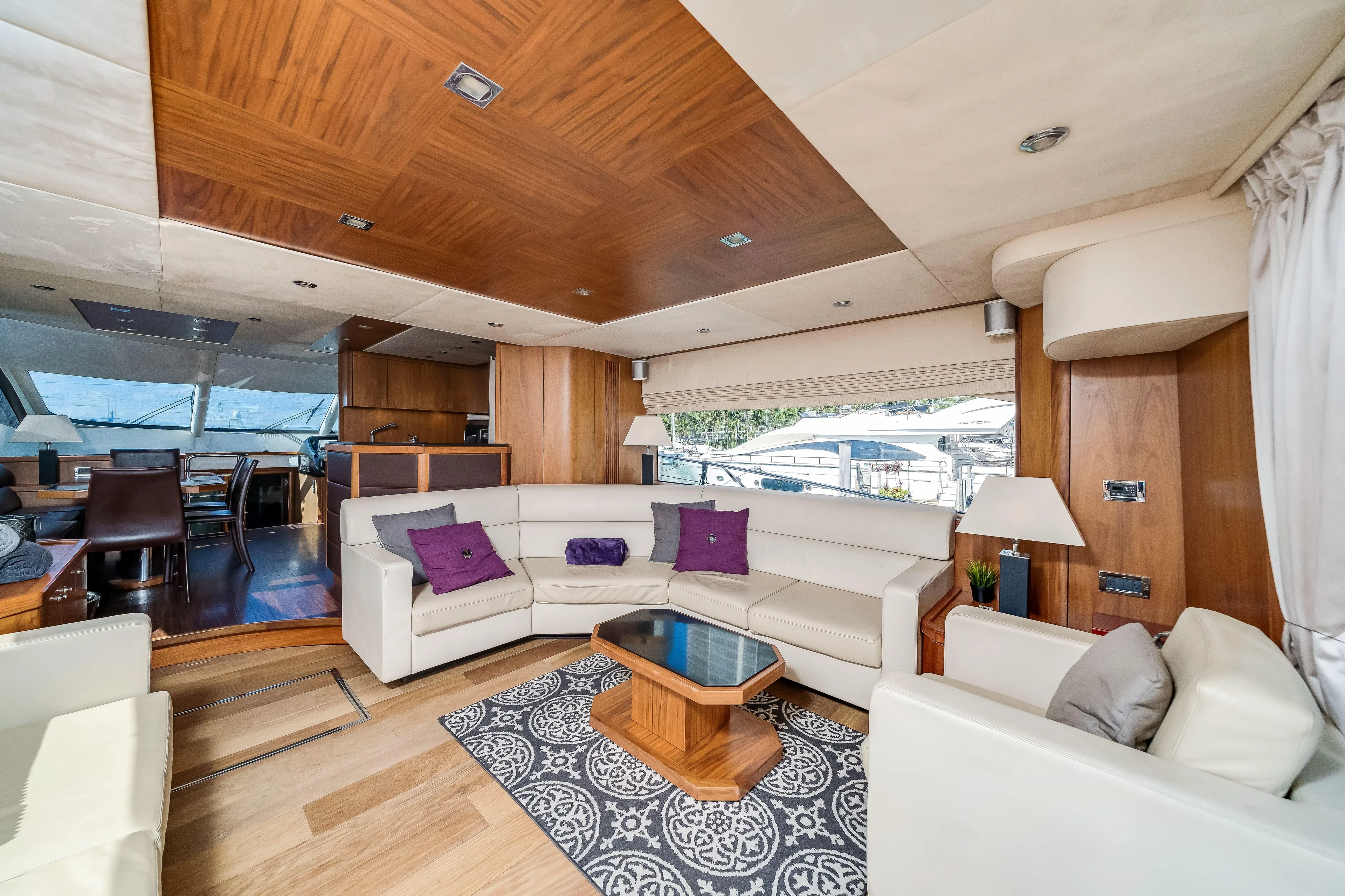 Twins Yacht Photos Pics Luxurious interior of 2009 Sunseeker Manhattan 70 yacht with elegant seating and wooden accents.