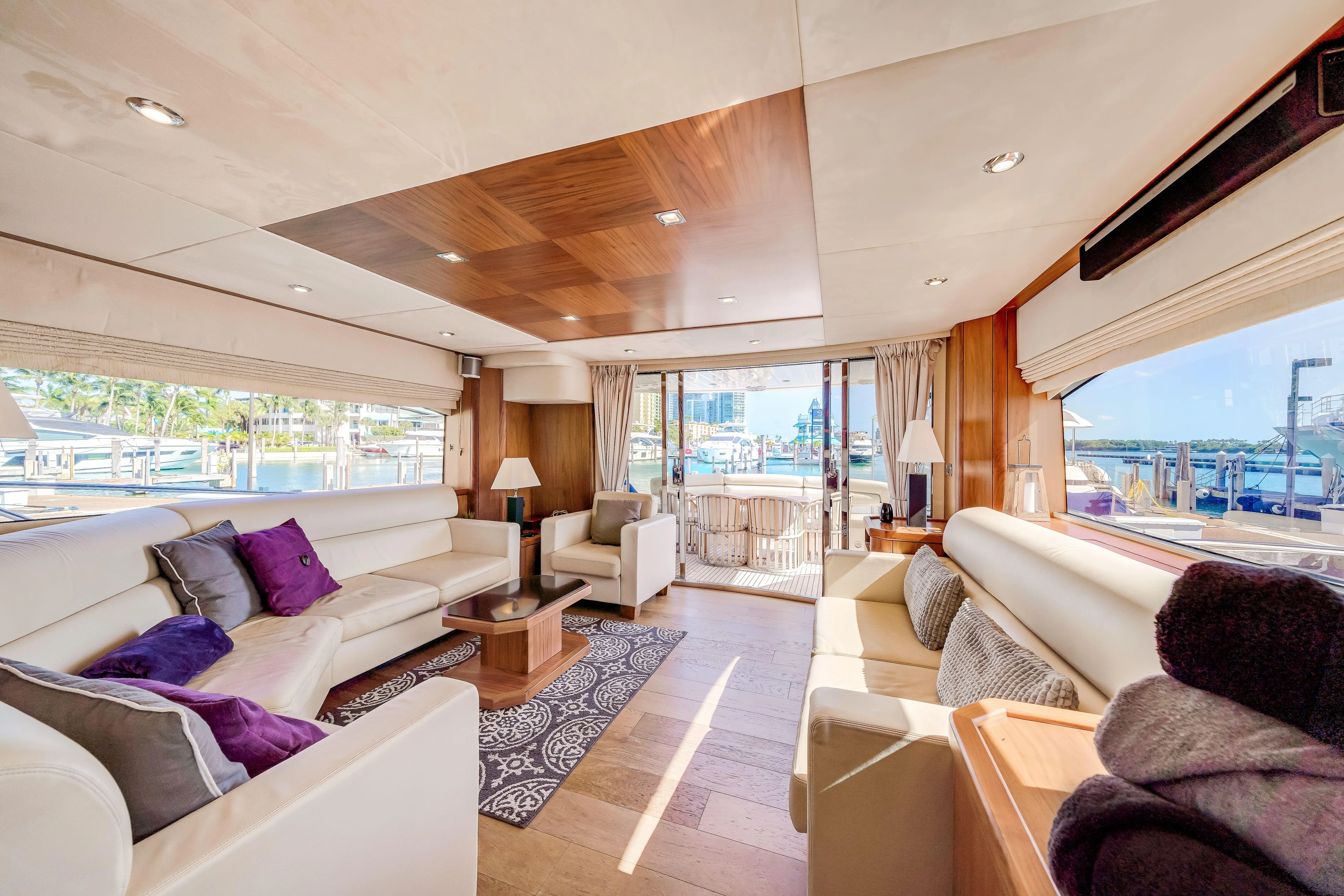 Twins Yacht Photos Pics Luxurious interior of 2009 Sunseeker Manhattan 70 yacht with elegant seating and scenic views.