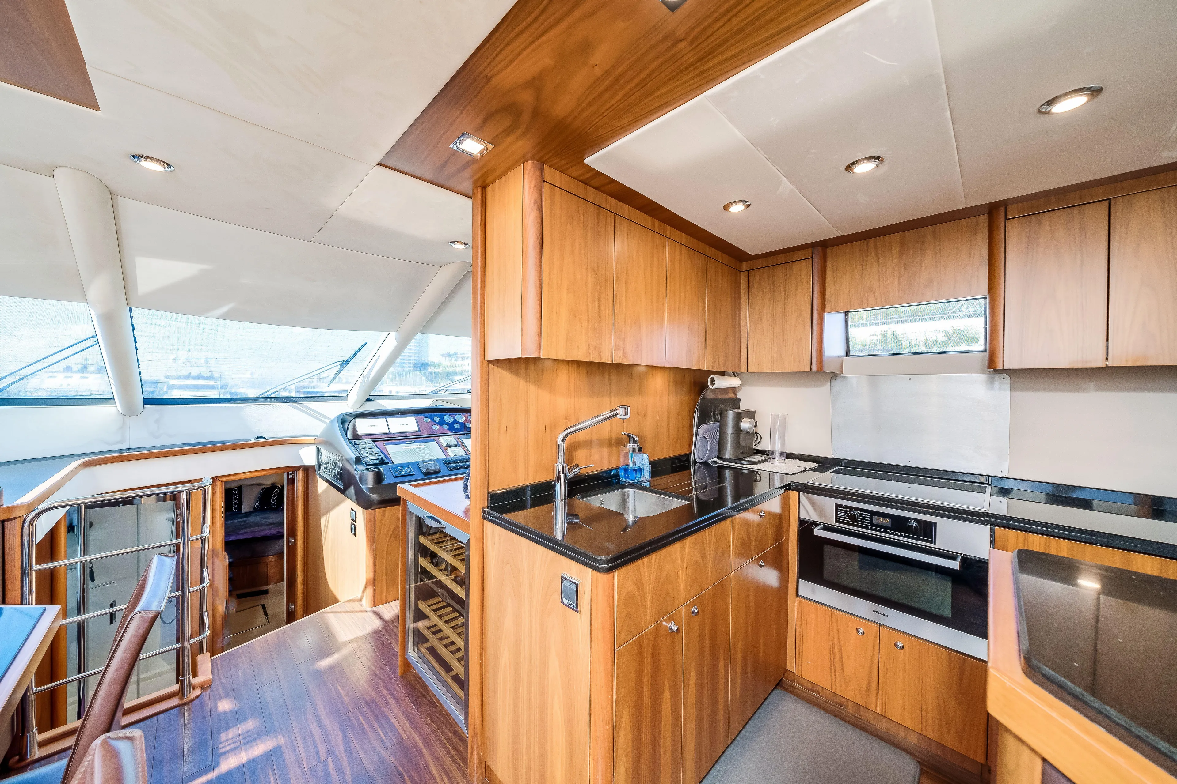 Twins Yacht Photos Pics Luxurious 2009 Sunseeker Manhattan 70 yacht interior with modern kitchen and helm.