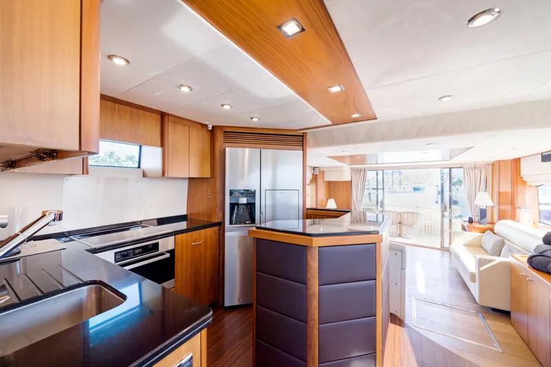 Twins Yacht Photos Pics Luxurious interior of 2009 Sunseeker Manhattan 70 yacht with modern kitchen and spacious living area.