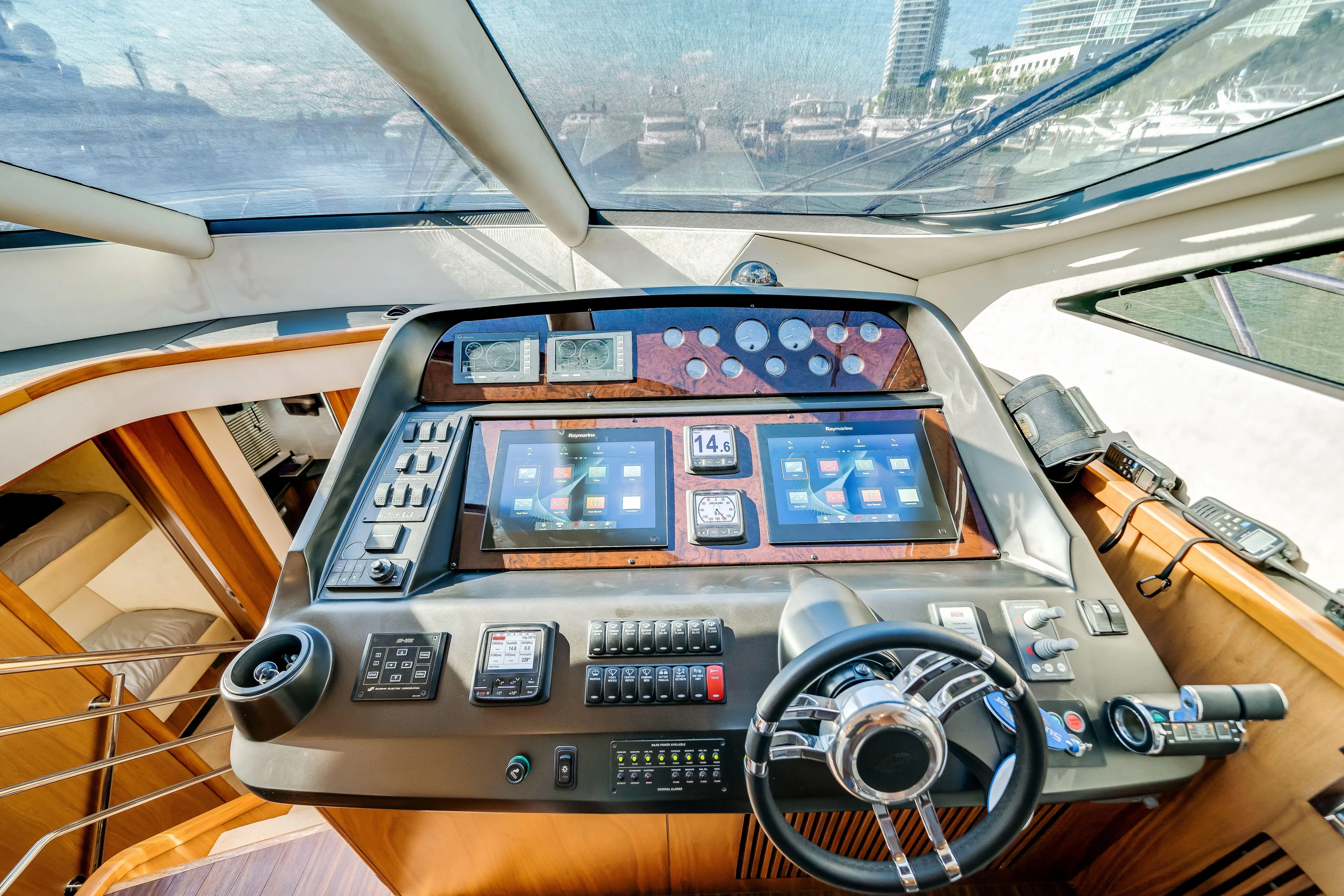 Twins Yacht Photos Pics 2009 Sunseeker Manhattan 70 yacht helm with advanced navigation controls and displays.