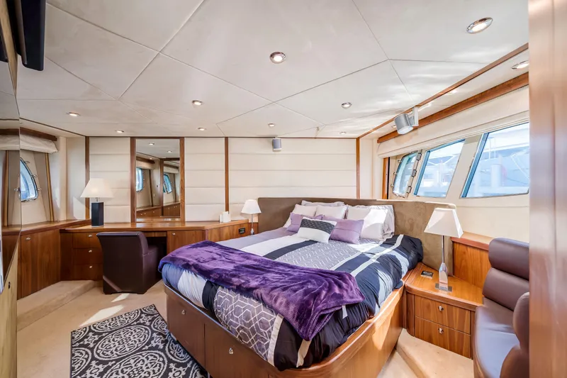 Twins Yacht Photos Pics Luxurious bedroom interior of 2009 Sunseeker Manhattan 70 yacht with elegant decor.