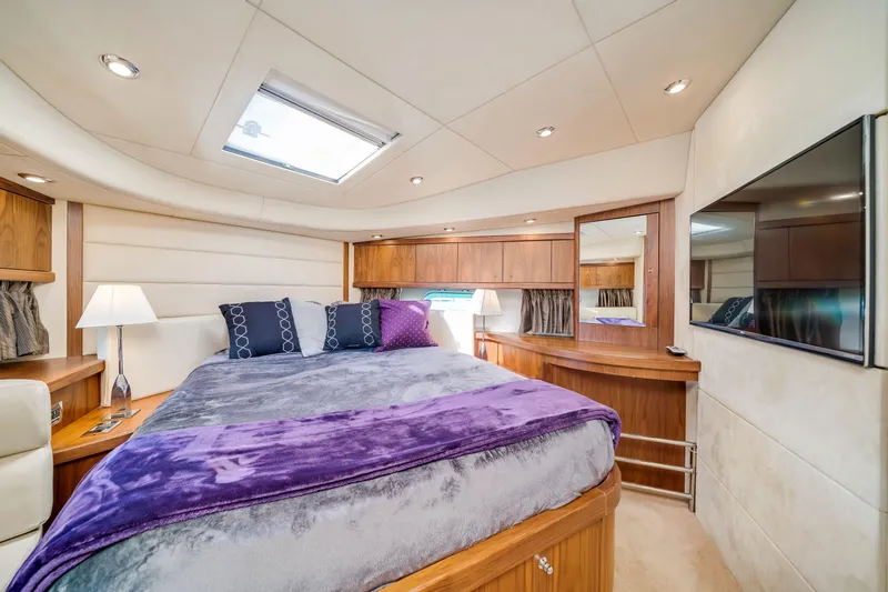 Twins Yacht Photos Pics Luxurious bedroom interior of 2009 Sunseeker Manhattan 70 yacht with modern decor.