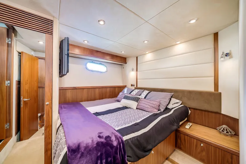 Twins Yacht Photos Pics Luxurious bedroom interior of 2009 Sunseeker Manhattan 70 yacht with elegant bedding.