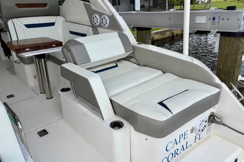 Liquid Asset Yacht Photos Pics 2024 Tiara Yachts 34 LX interior with luxurious seating and table, docked in Cape Coral.