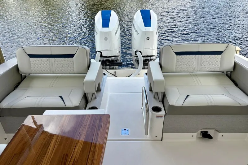 Liquid Asset Yacht Photos Pics 2024 Tiara Yachts 34 LX with luxurious seating and dual Mercury outboard engines.