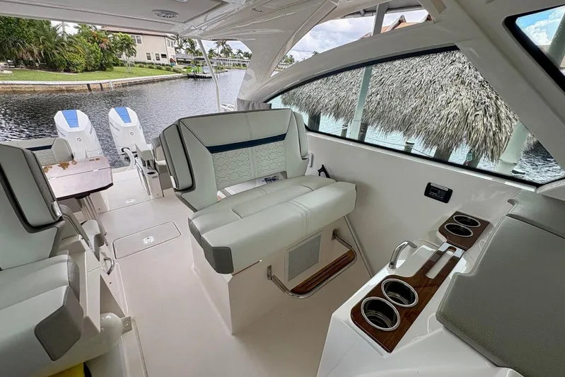 Liquid Asset Yacht Photos Pics 2024 Tiara Yachts 34 LX interior with luxurious seating and modern design.