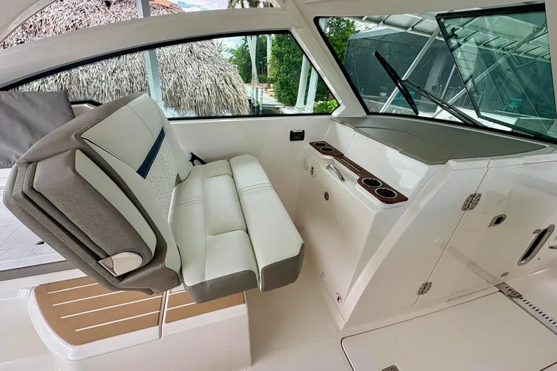 Liquid Asset Yacht Photos Pics 2024 Tiara Yachts 34 LX interior with luxurious seating and modern dashboard.