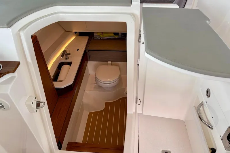 Liquid Asset Yacht Photos Pics 2024 Tiara Yachts 34 LX interior bathroom with sink and toilet.
