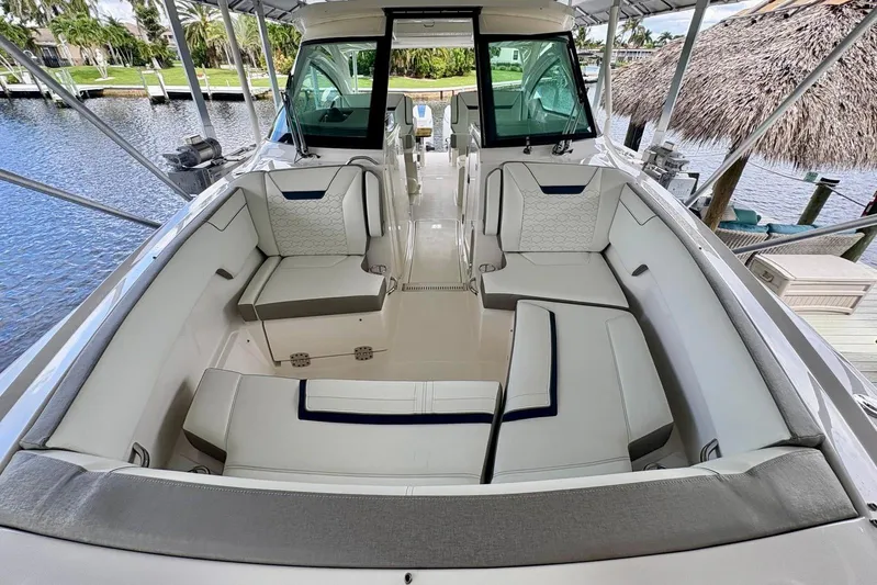 Liquid Asset Yacht Photos Pics 2024 Tiara Yachts 34 LX interior with luxurious seating and modern design.