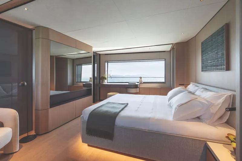 Yacht Photos Pics Luxurious bedroom interior of 2026 Azimut GRANDE 30M yacht with ocean view.