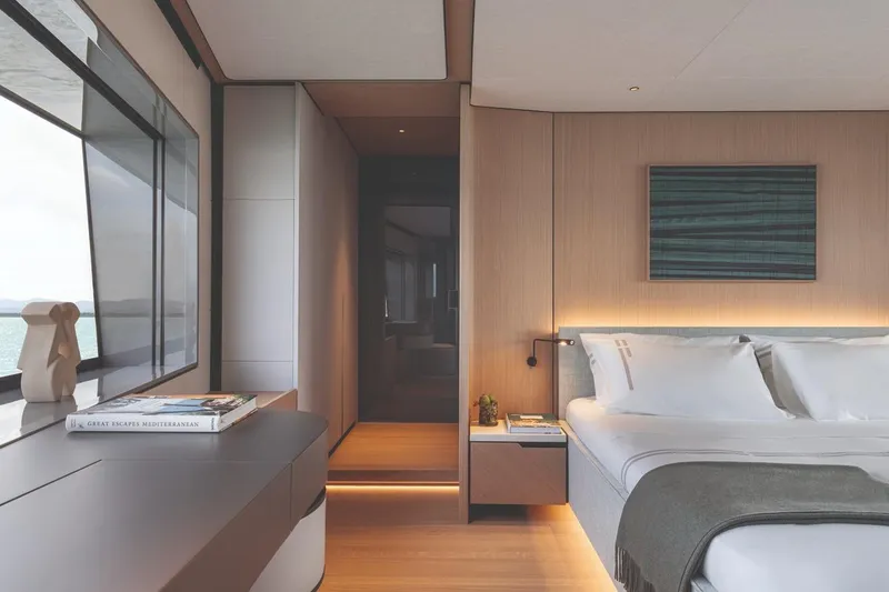  Yacht Photos Pics Luxurious bedroom interior of 2026 Azimut GRANDE 30M yacht with modern design and ocean view.