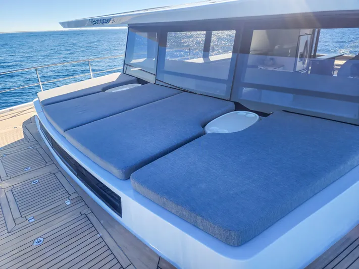  Yacht Photos Pics Luxurious Sunpower 44 VIP yacht deck with cushioned seating, 2022 model, overlooking the ocean.