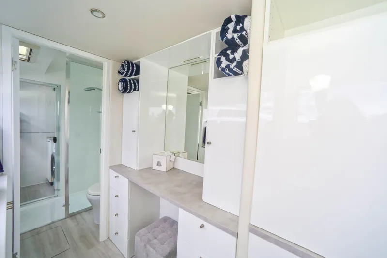  Yacht Photos Pics Modern bathroom interior in 2022 Sunpower 44 VIP yacht, featuring sleek design and ample storage.